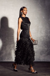 Vestido midi de punto con borlas y espalda descubierta de Mavis